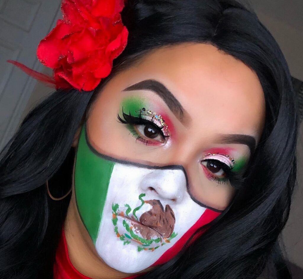Woman with Mexican flag face paint and matching green, white, and red eyeshadow