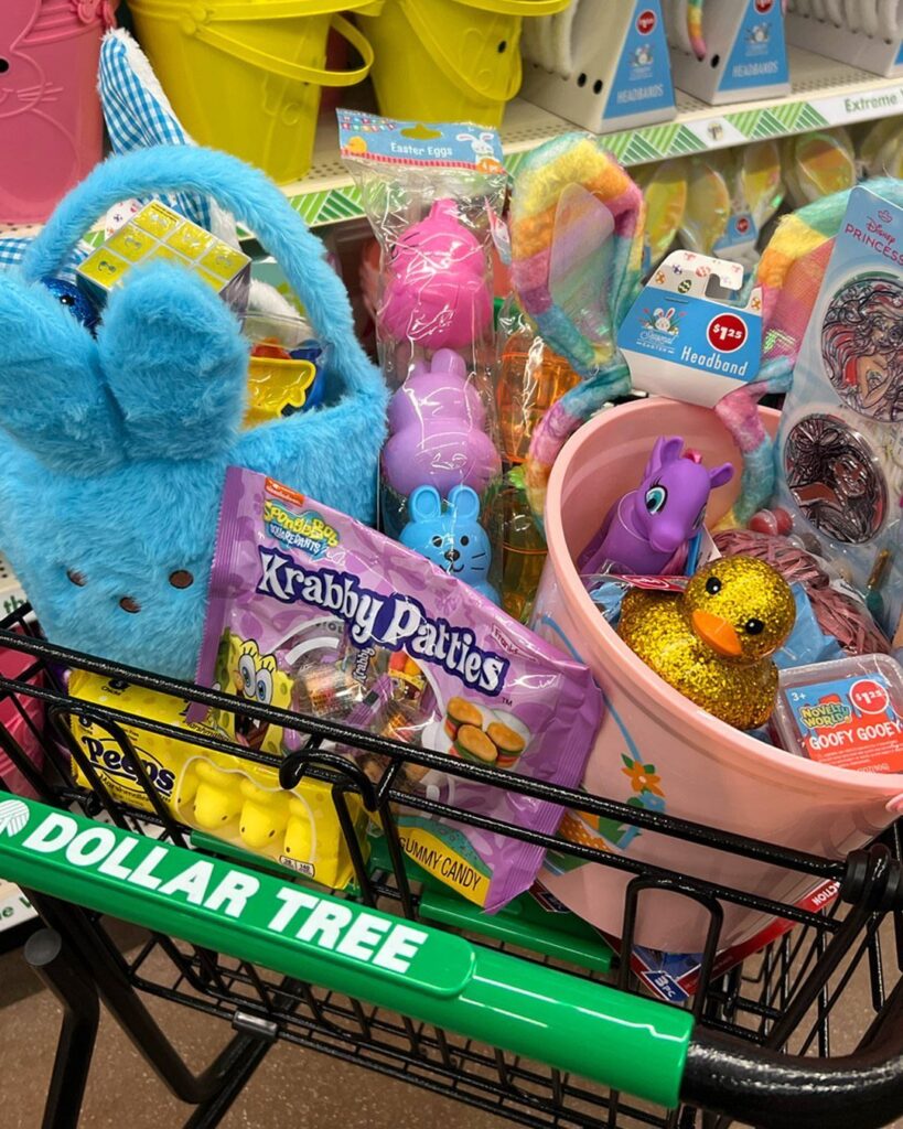 Easter basket items in a Dollar Tree shopping cart including plush bunny and candy