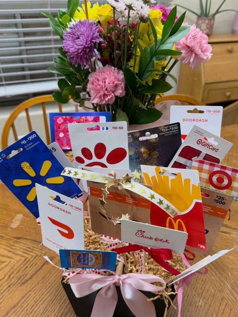 Gift cards from various restaurants and stores arranged in a black Easter basket.