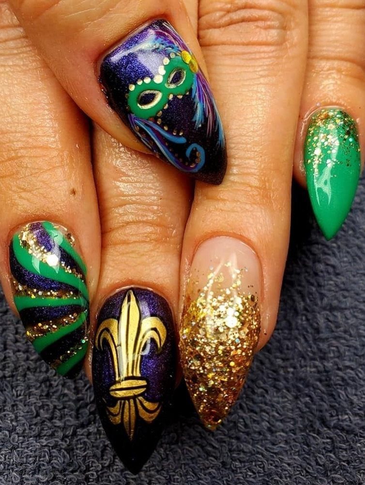 Mardi Gras themed nail art with purple, green, and gold glitter designs.