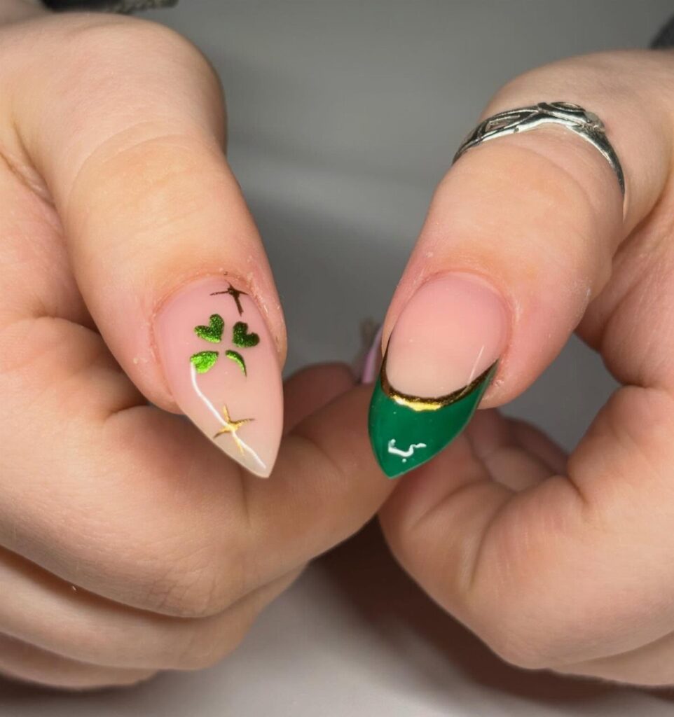 Almond shaped nails with green shamrock and gold accents for St Patrick's Day
